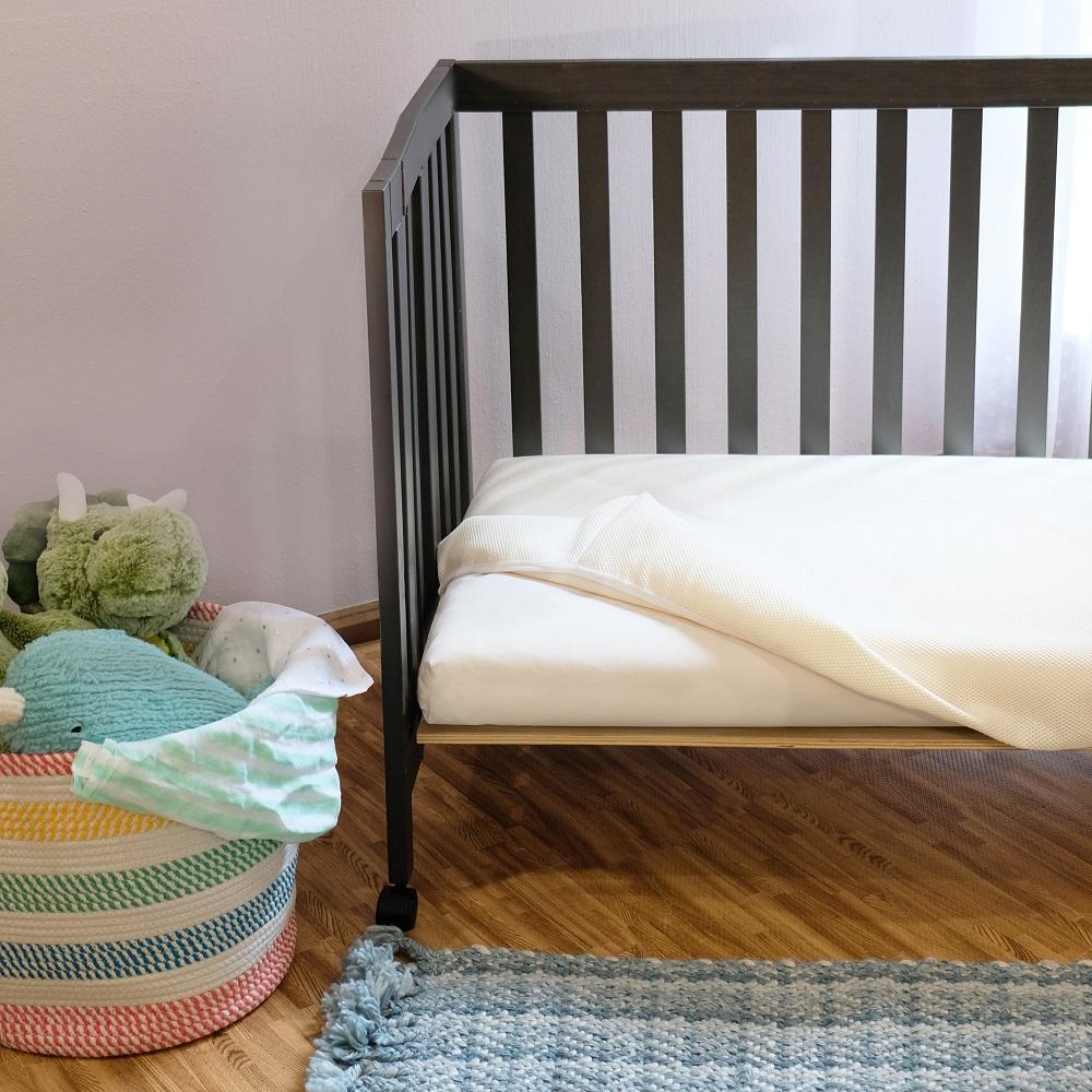 Naturepedic crib mattress pad sale